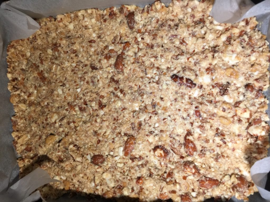Image of the mixture for the crust of the no bake peanut butter cheesecake