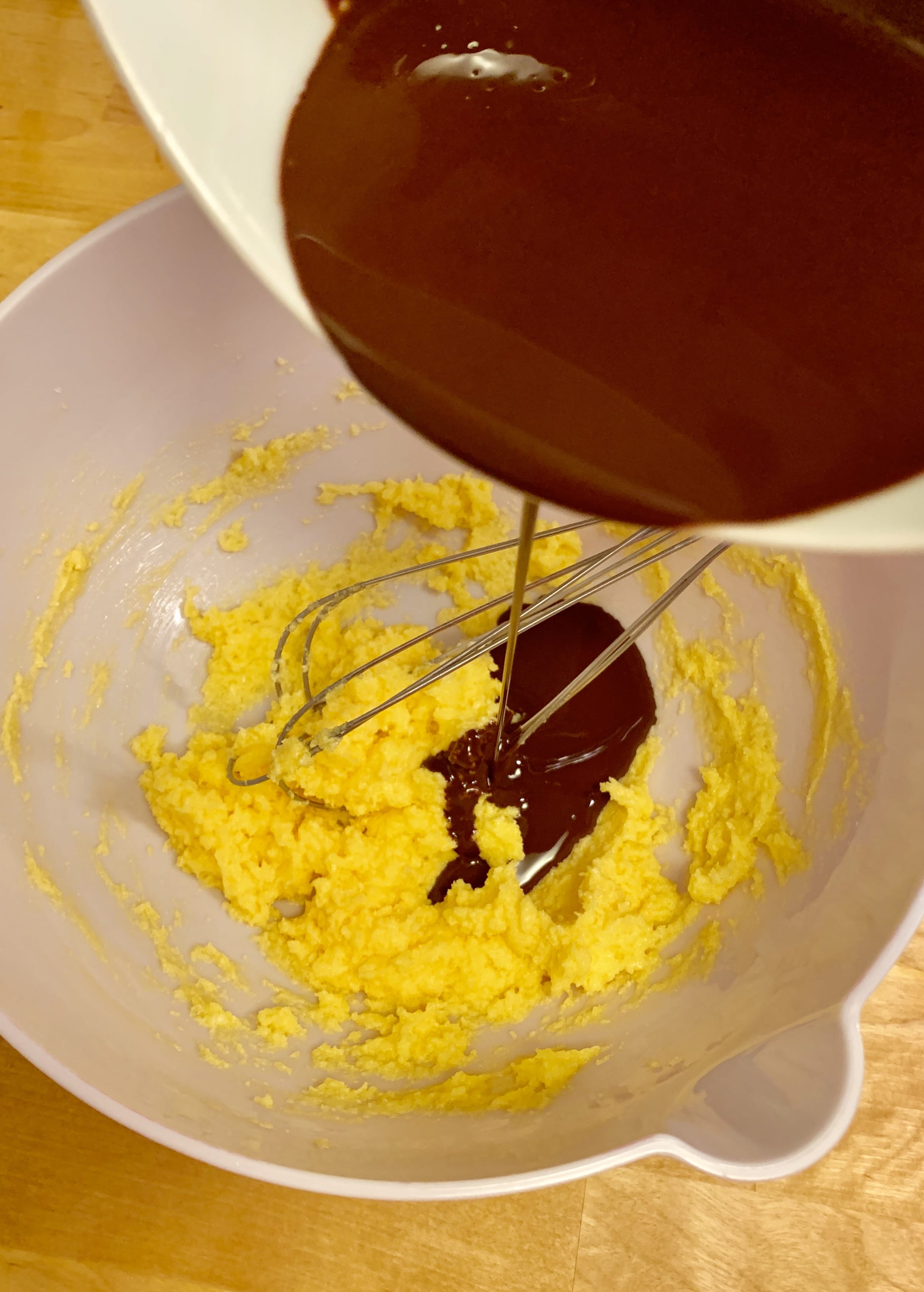 Picture of pouring a chocolate in a yellow mixture
