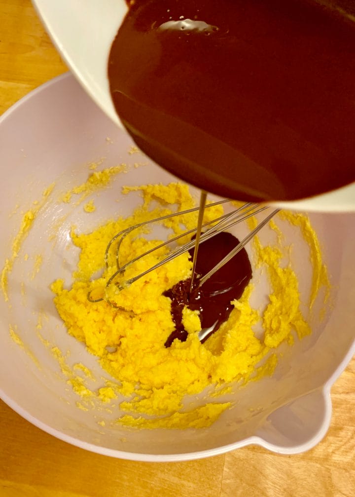 Picture of pouring a chocolate in a yellow mixture 