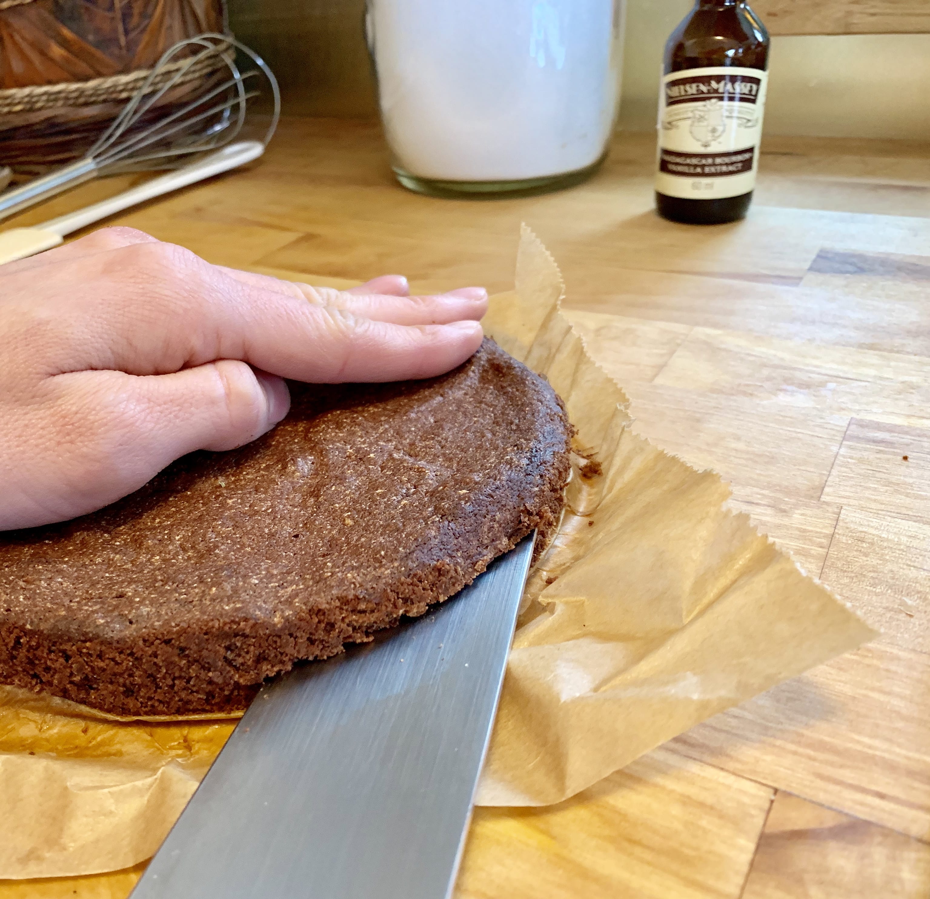 Picture of a cutting a bottom layer of a cake