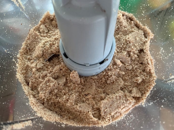 Picture of preparing the crust for the raw keto chocolate cheesecake