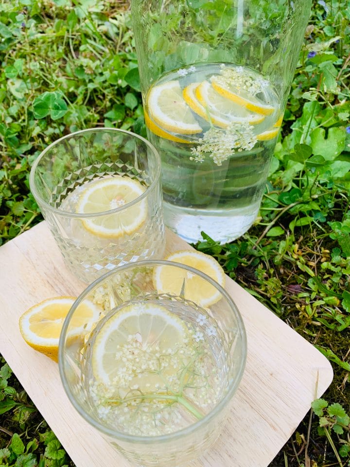 Picture of elderflower 0 calories and 0 carbs drink on the grass in the garden