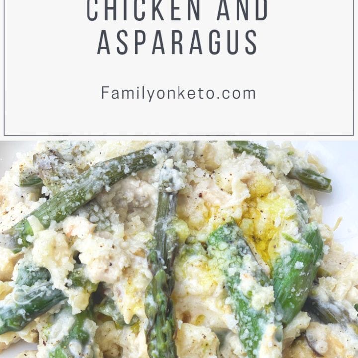 Picture of keto cauli risotto with asparagus and chicken meat in a plate, sprinkled with parmigiano and olive oil