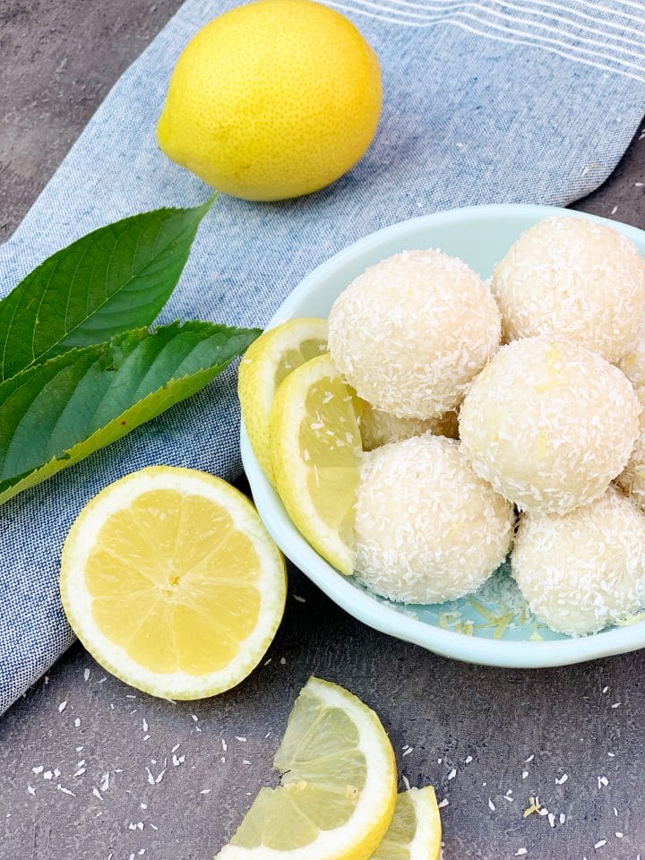 Picture of lemon keto energy balls and lemon slices