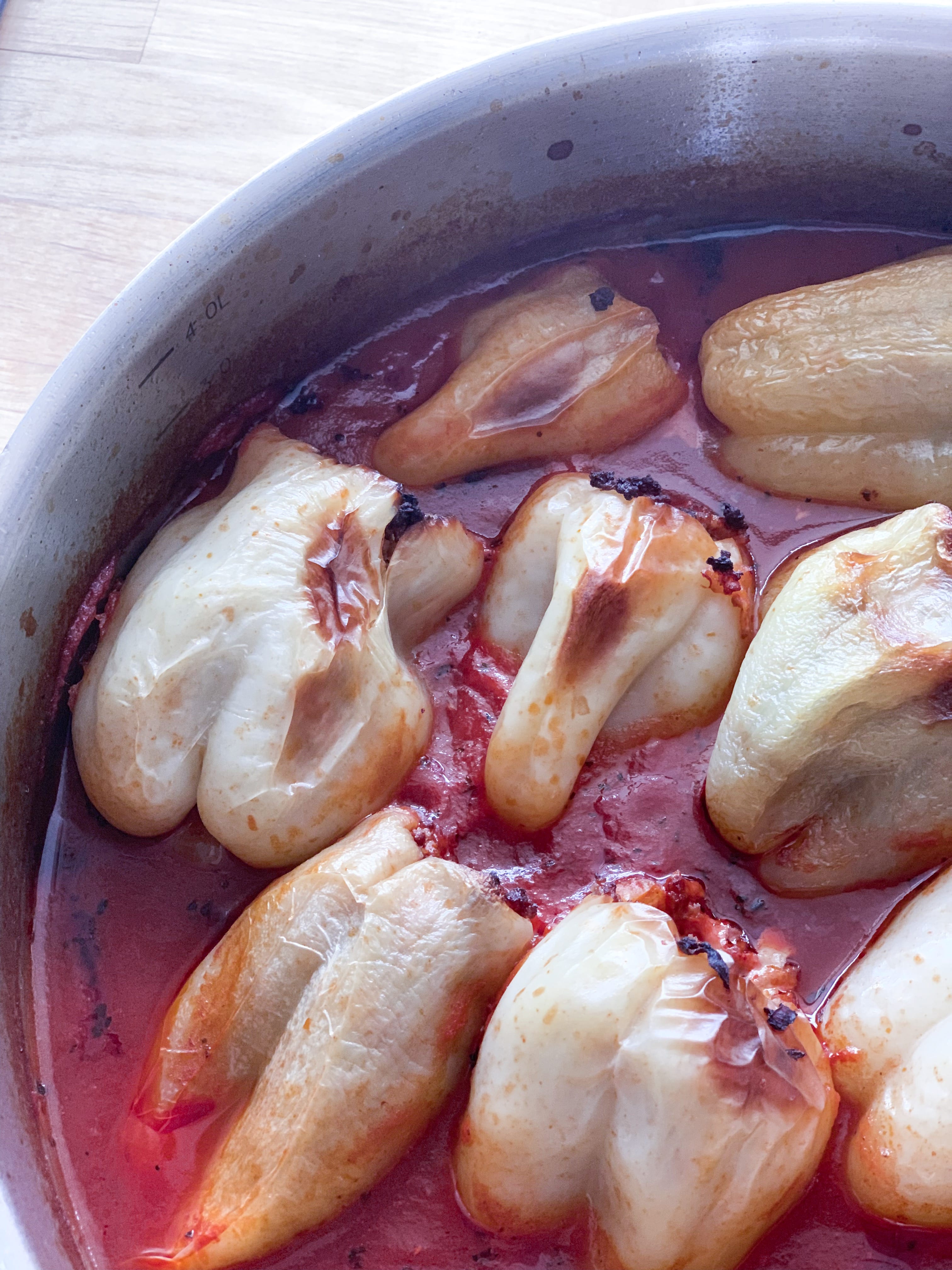 Picture of baked keto stuffed peppers in tomato sauce