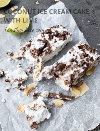 Picture of keto coconut ice cream cake bars on the table wit lime slices