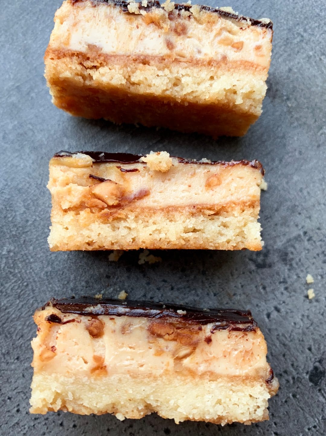 Picture of keto peanut butter cheesecake bars with crispy crust of almonds and coconut flour