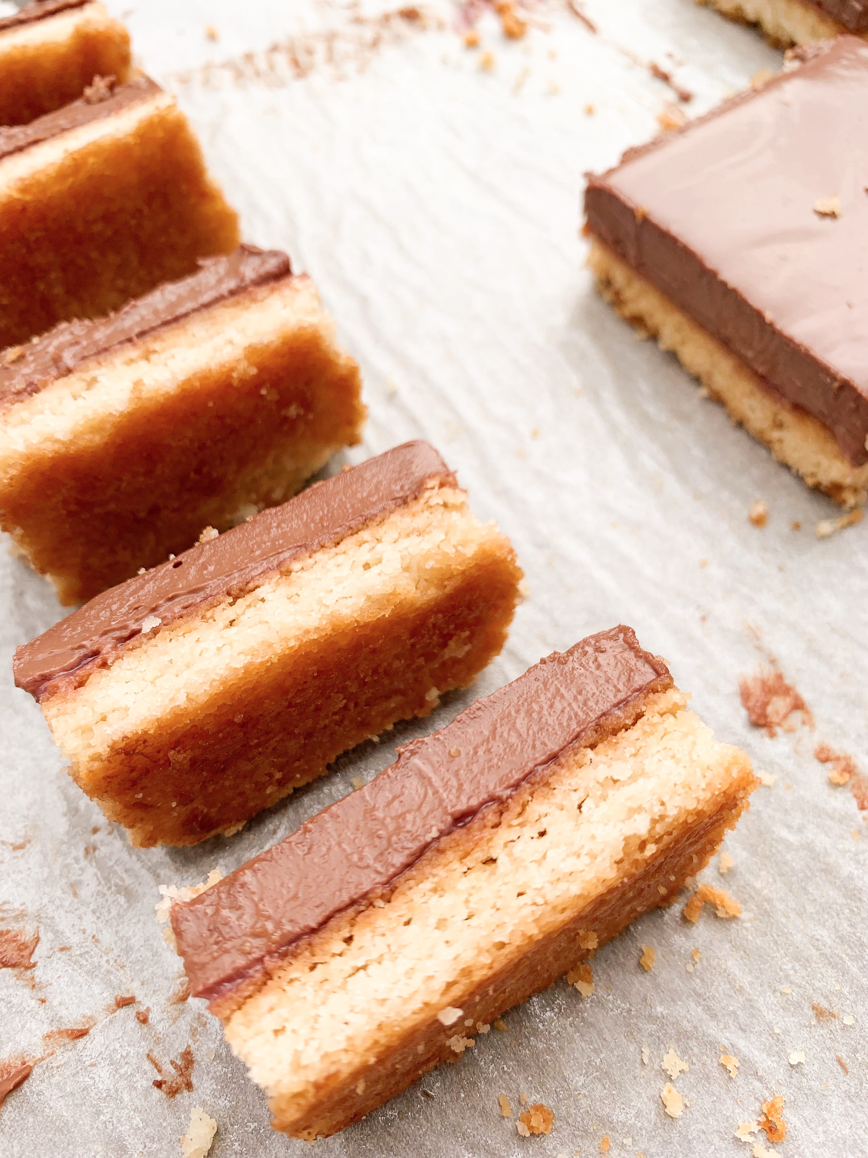 Picture of chocolate cake bars with keto chocolate ganache with strawberries