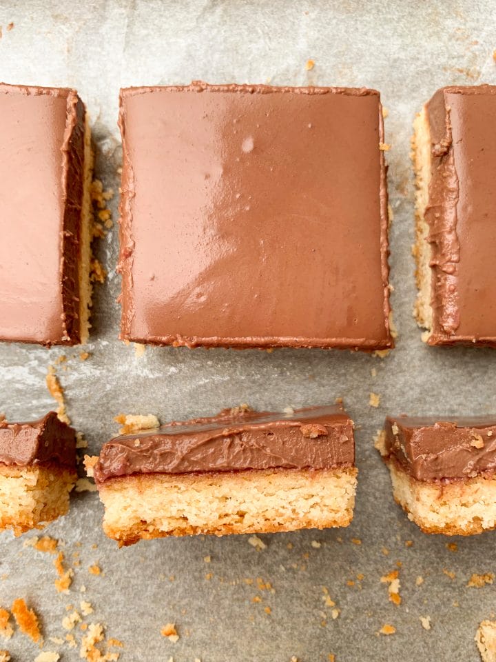 Picture of slices of keto chocolate cake with keto strawberry jam and ganache