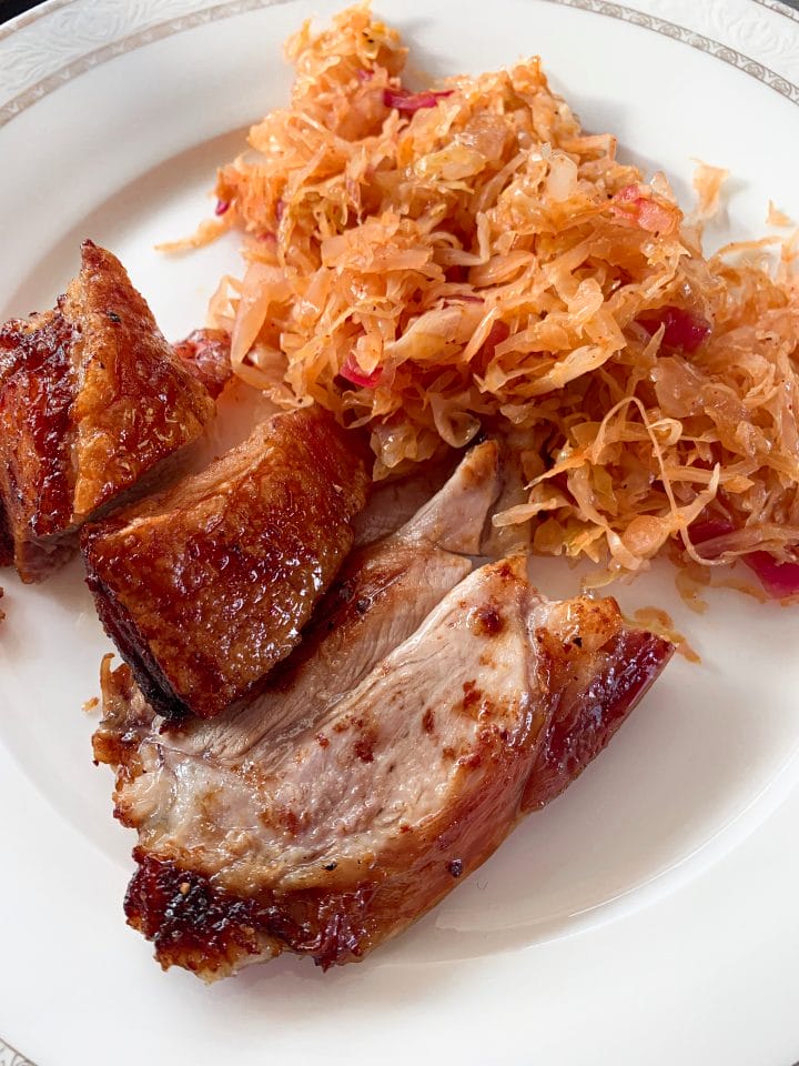 Picture of served roasted pork with fried sauerkraut