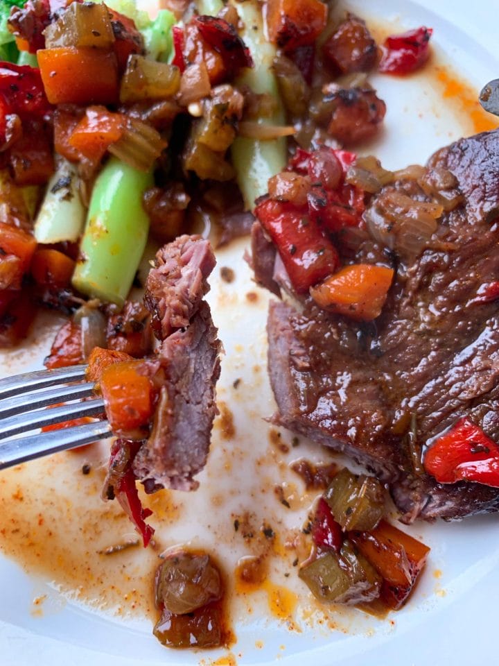Picture of juicy and tender wild boar steak with low carb veggies