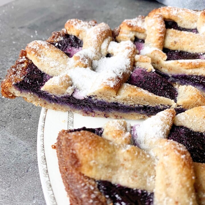 Picture of a gluten free and sugar free keto Linzer cake with blueberry jam