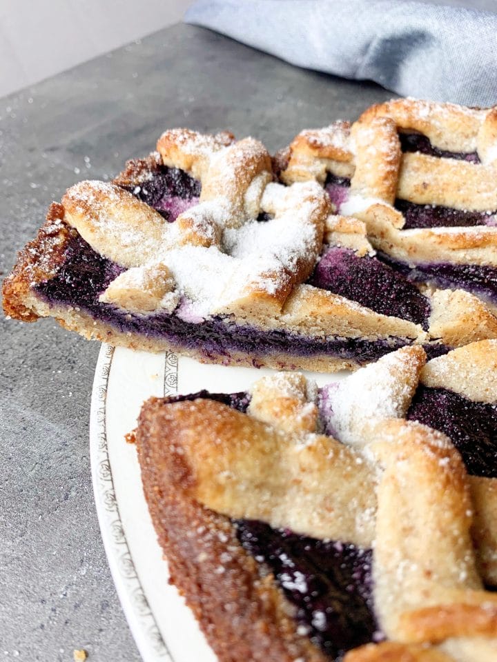 Picture of a gluten free and sugar free keto Linzer cake with blueberry jam