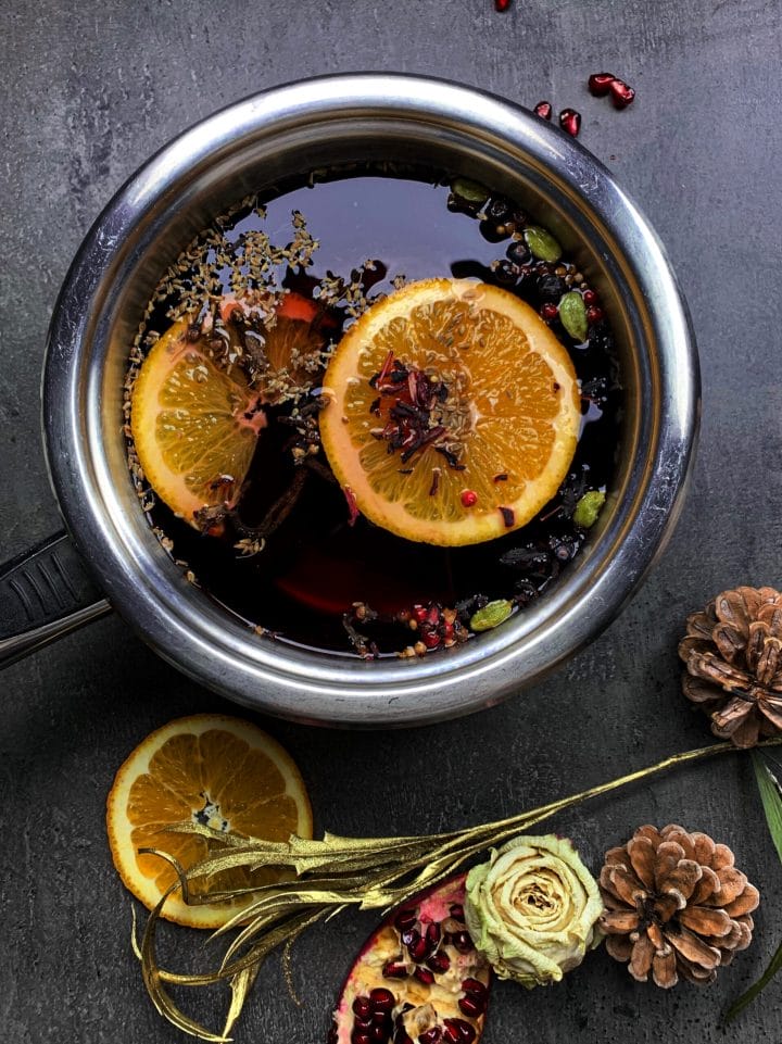 Picture of a large sauce pan with low carb mulled wine and mulling spices