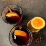 Picture of 2 glasses of keto hot gin cocktail with cinnamon and orange slice