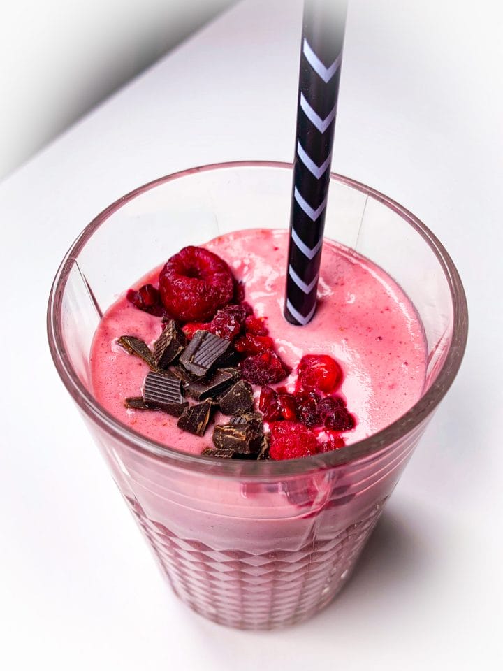 Photo of keto raspberry smoothie with chocolate whey powder