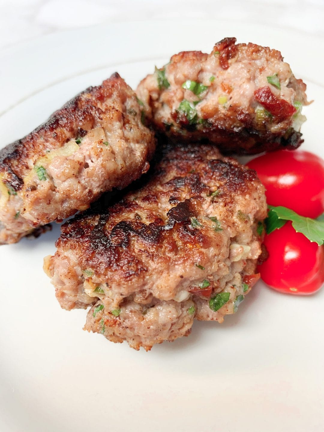 Photo of low carb breakfast sausages fried on a pan