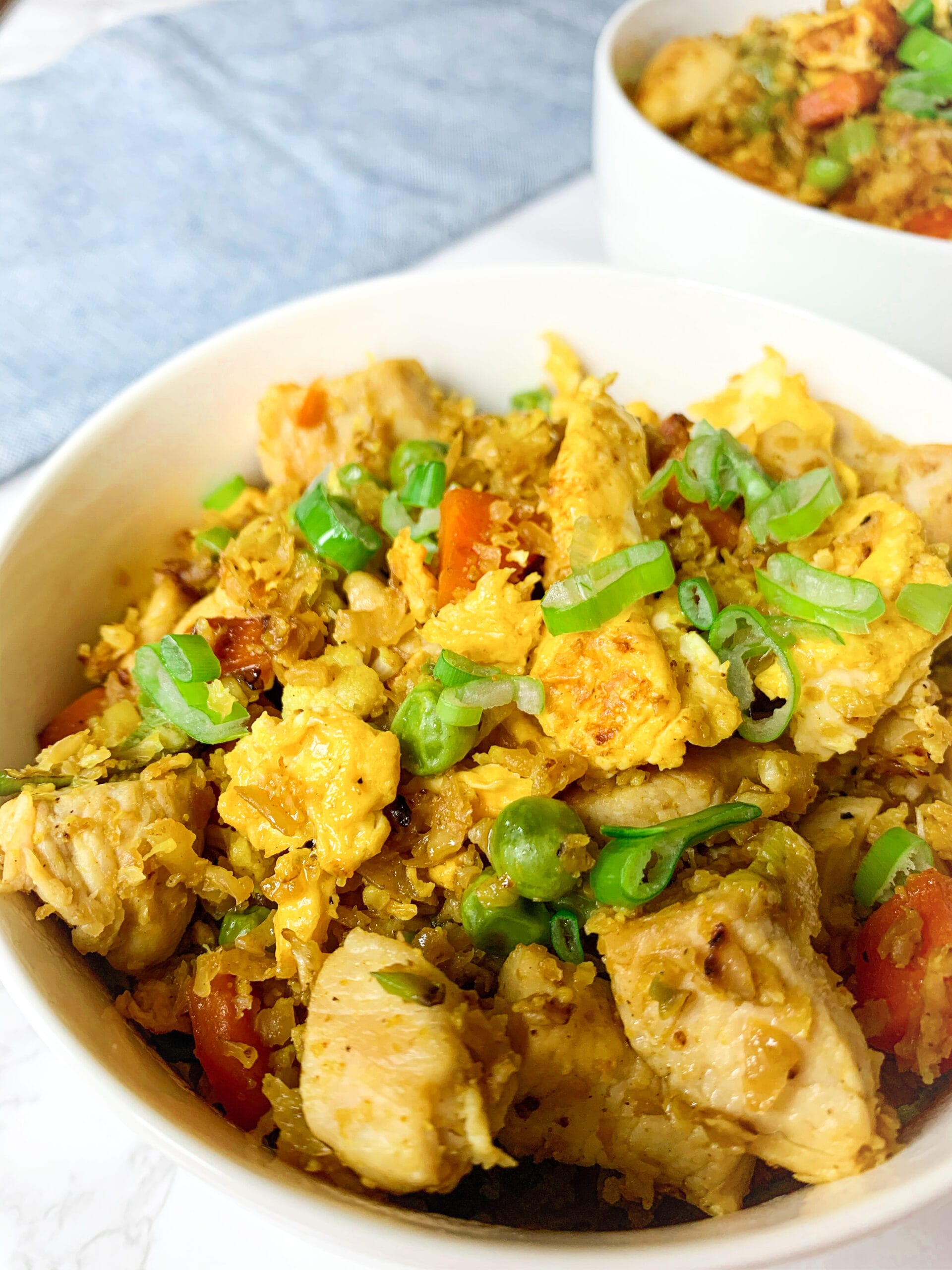 Picture of a low carb fried cauliflower rice with chicken and vegetable and coconut aminos