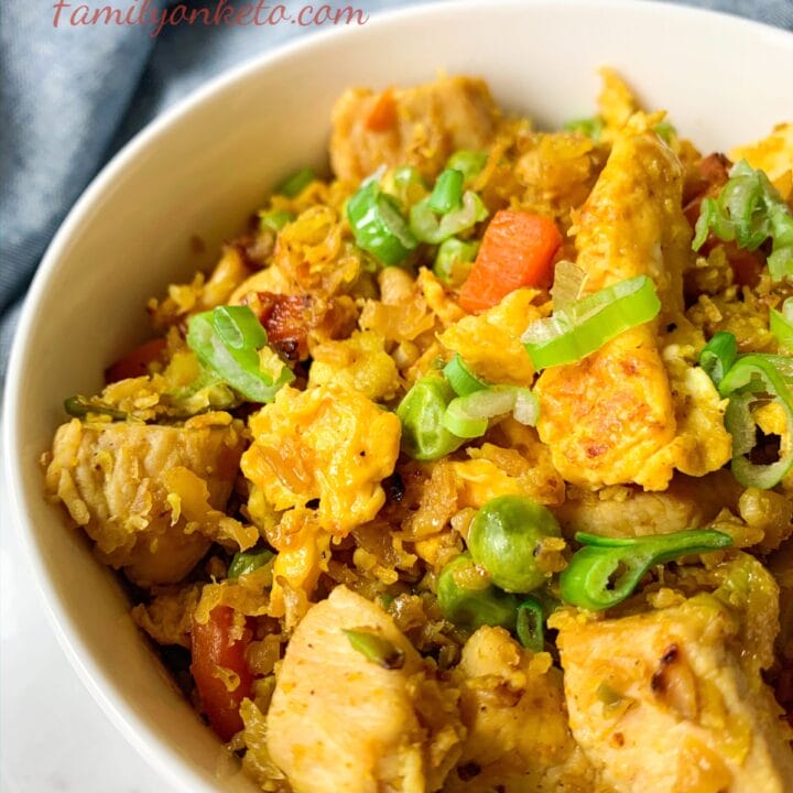 Picture of a bowl fill of keto chicken fried rice with vegetables and cauliflower rice