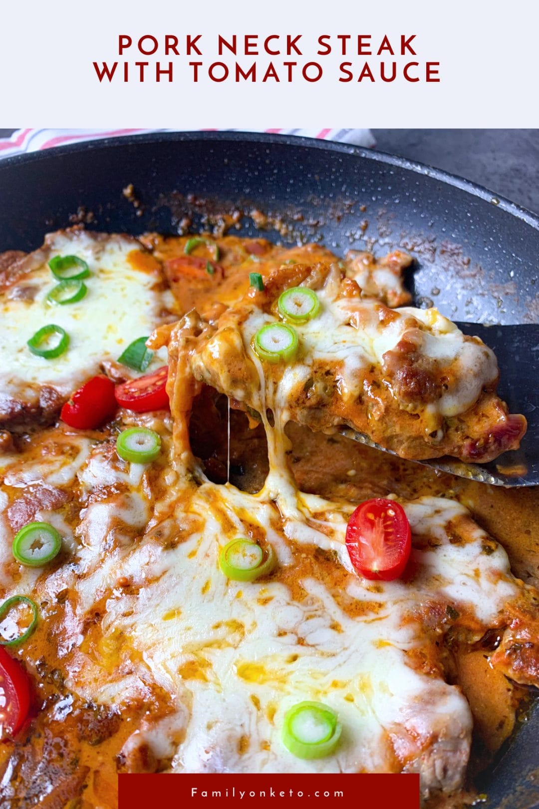 Pork neck steak with tomato sauce with melted mozzarella cooked in skillet