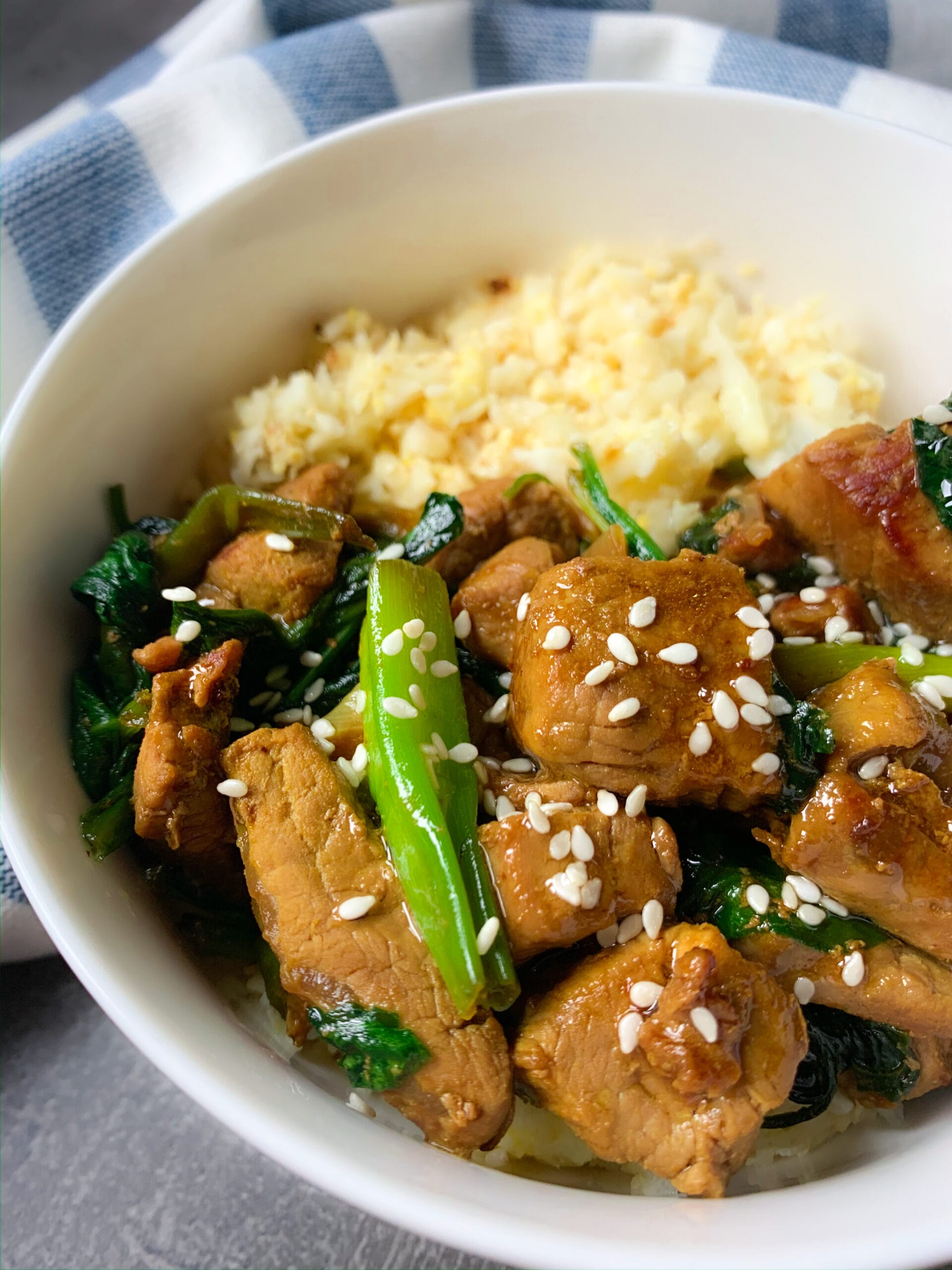 Thai pork tenderloin in a bowl with keto cauliflower rice
