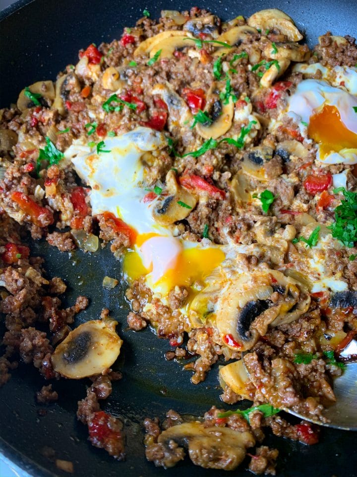 Picture of low carb ground beef hash with eggs, feta cheese and peppers