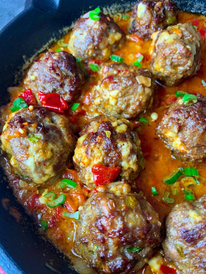 Picture of Balkan style low carb meatballs with bacon and cheese with sauce with peppers and feta cheese