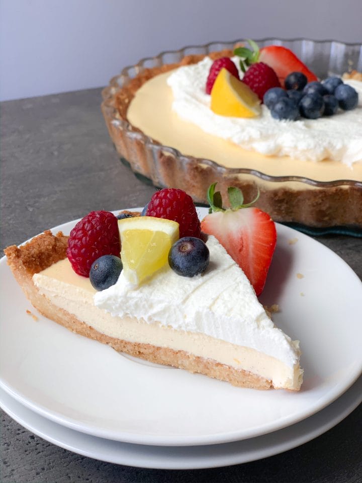 Picture of keto lemon cream pie with topping and berries 