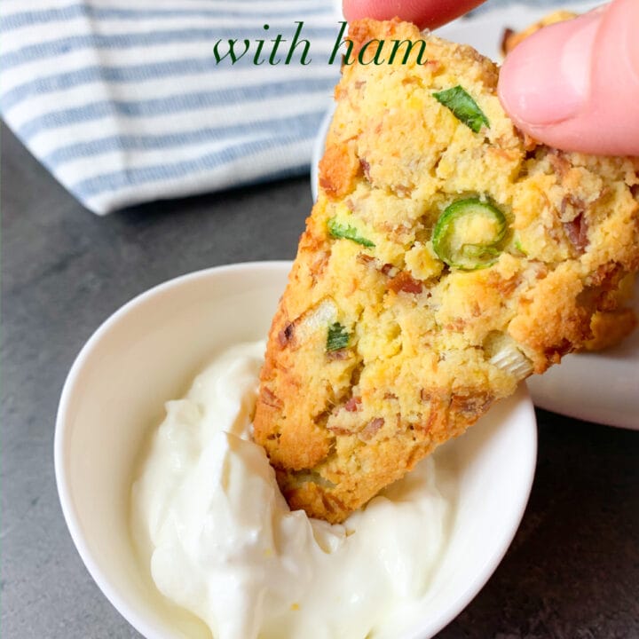Picture of keto scones with ham and cream cheese dipped in a sour cream