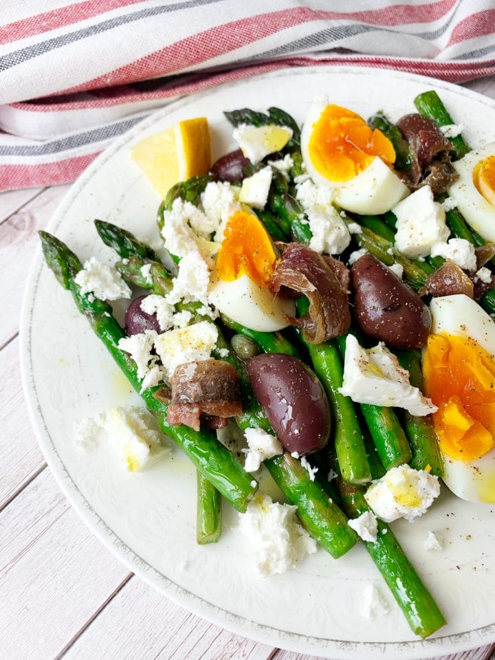 Photo of keto salad with asparagus and eggs with anchovies, capers and olives
