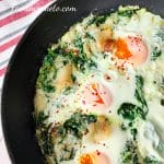 Picture of a skillet with keto spinach and eggs