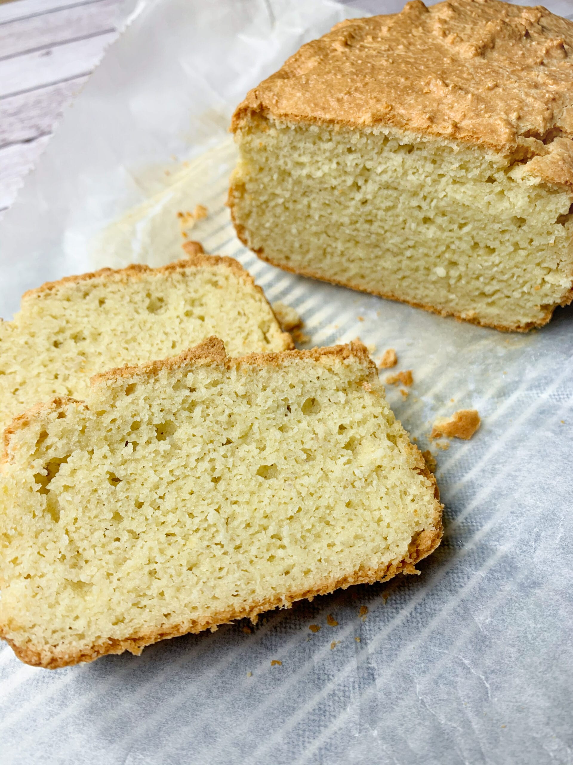Keto bread almond flour sliced with crispy crust and delicious not eggy crumb.