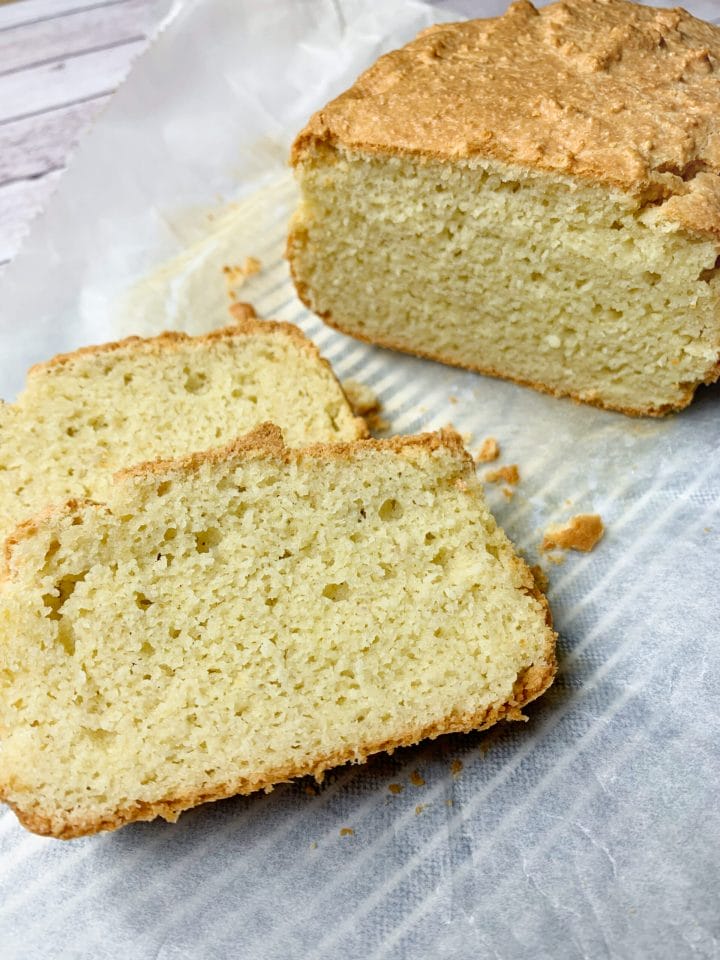 Keto bread almond flour sliced with crispy crust and delicious not eggy crumb.