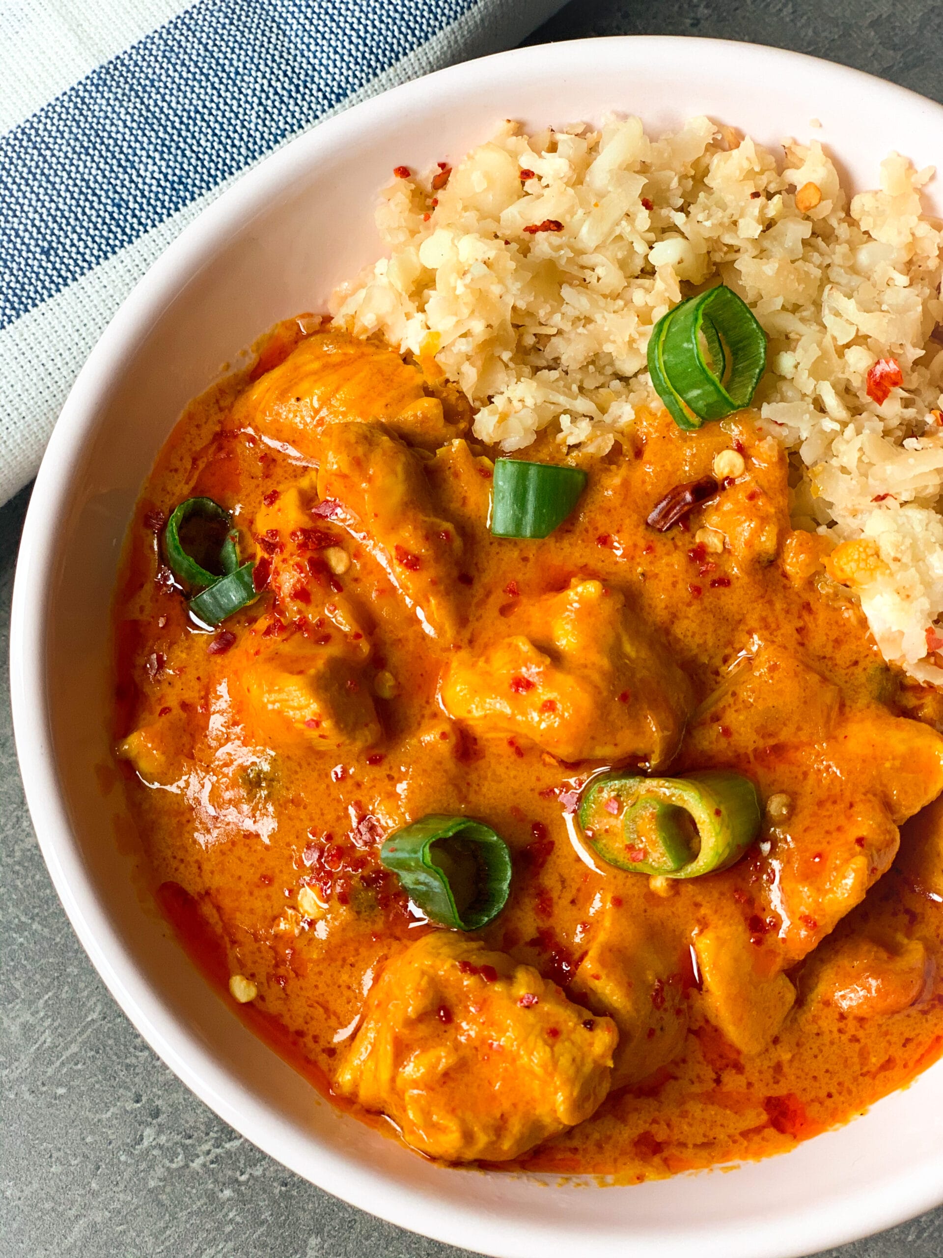Picture of low carb chicken curry in a bowl with fried riced cauliflower