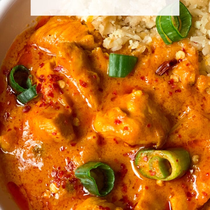 Picture of a bowl full of keto chicken curry with coconut and fried cauliflower rice