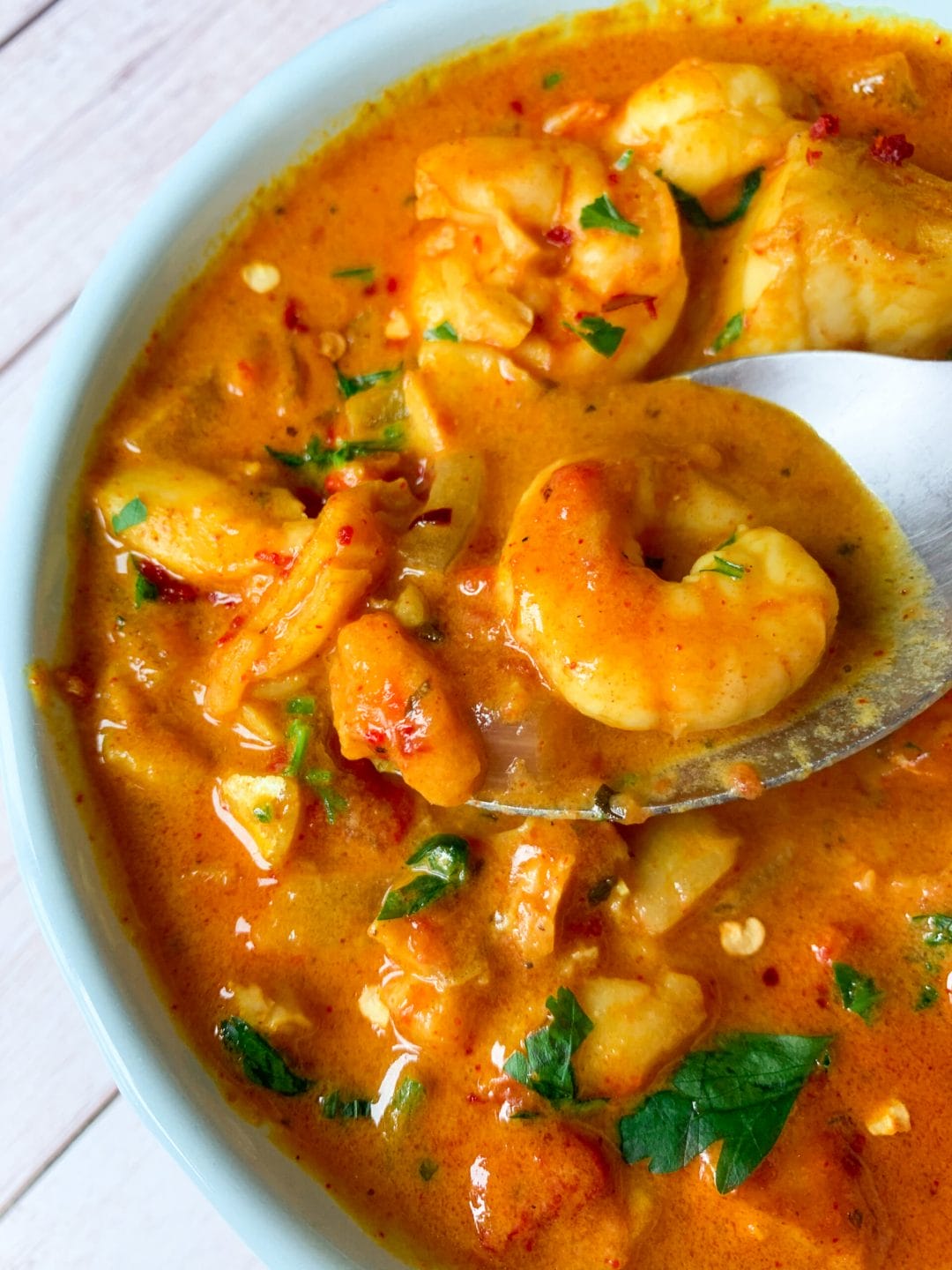 Picture of keto fish stew with fish fillets and shrimp or prawns and curry 