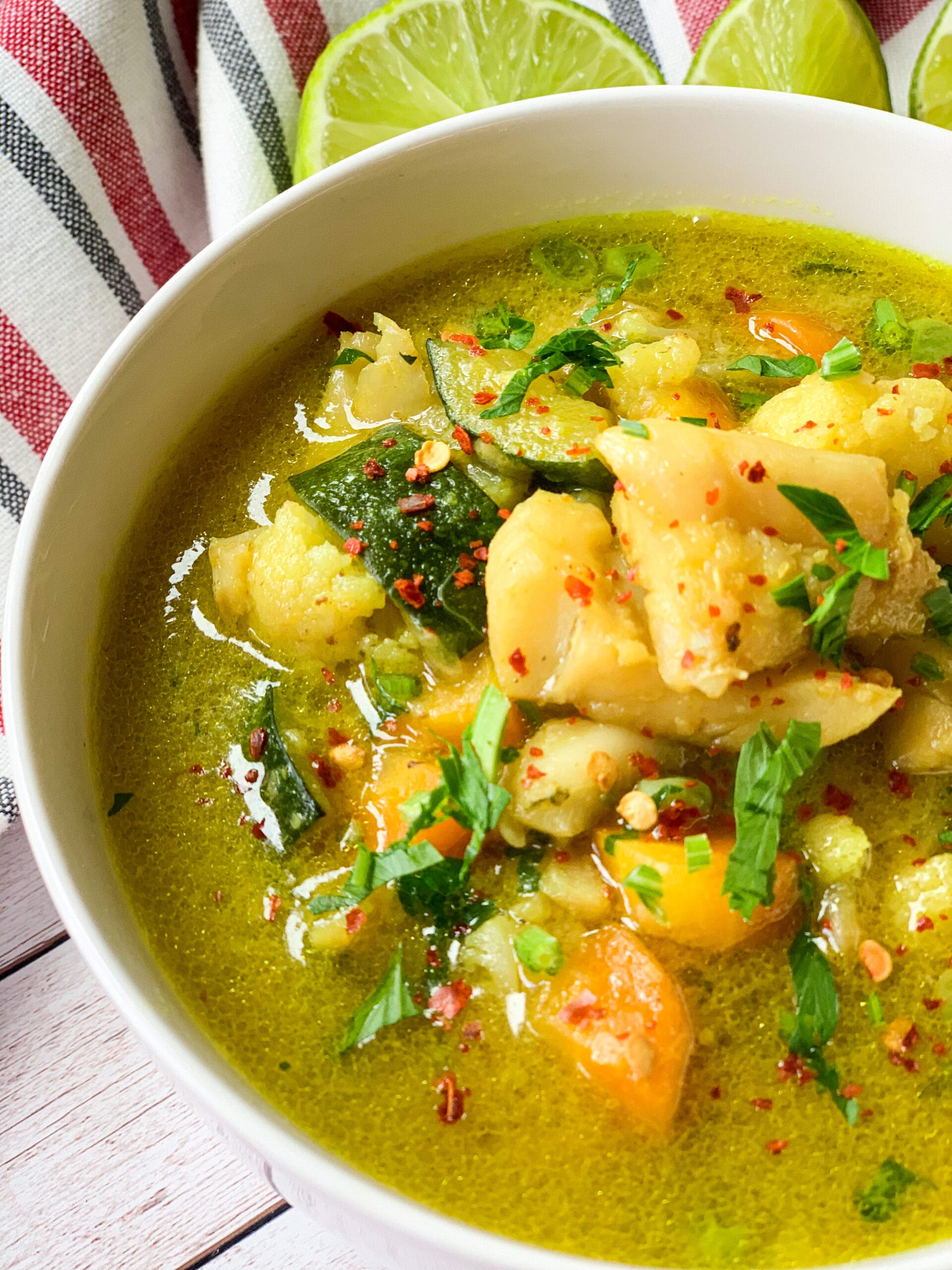 Picture of a bowl of cod chowder with coconut milk and veggies