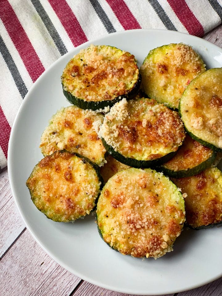 Picture of a plate with keto baked zucchini side dish with cheese and almond