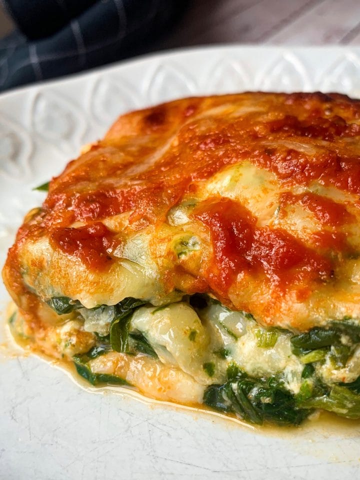 Picture of a slice of easy keto vegetarian lasagna with cheese and spinach