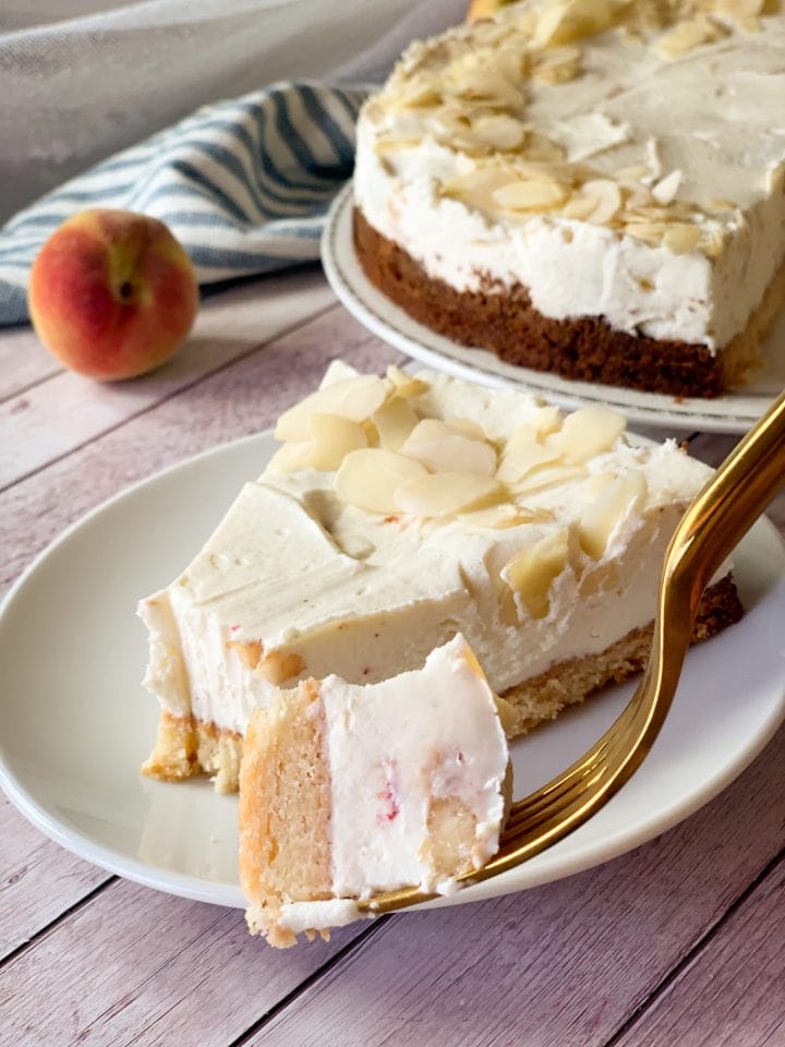 Picture of keto peach cheesecake decorated with almond flakes