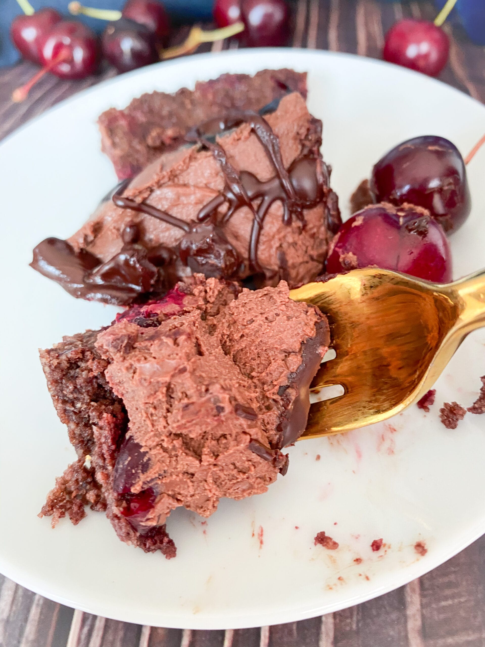 Picture of a slice of gluten free chocolate cherry cheesecake