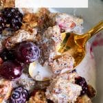 Picture of keto peanut butter granola in a bowl with berries and cream