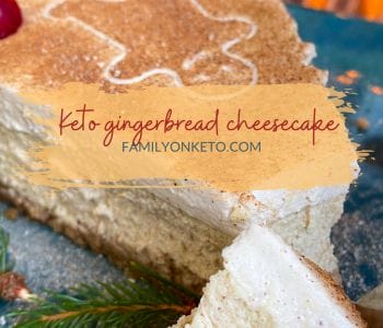Low carb gingerbread cheesecake slice with gingerbread man decoration on top and Christmas
