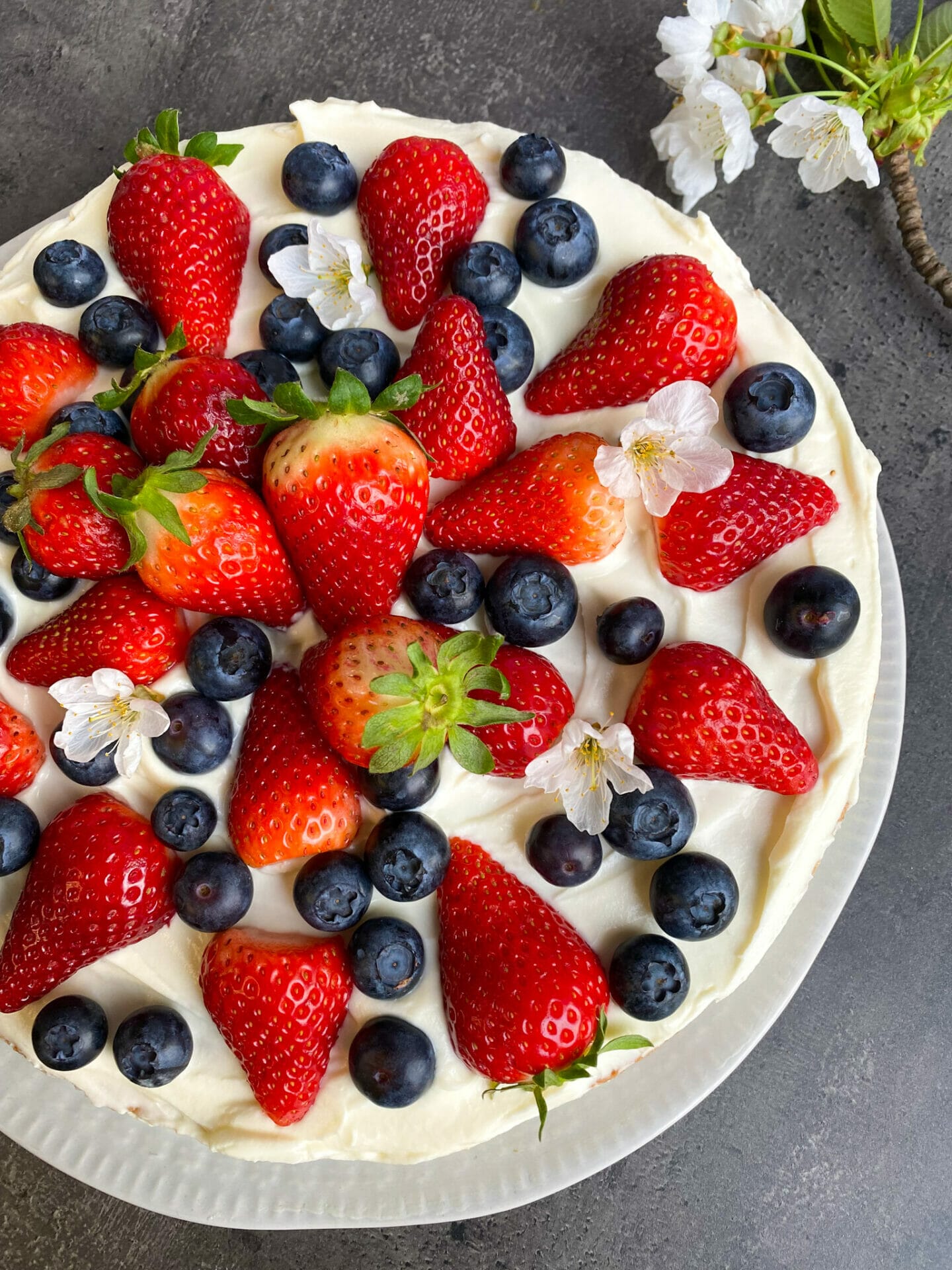 Keto tiramisu cake with strawberries and blueberries