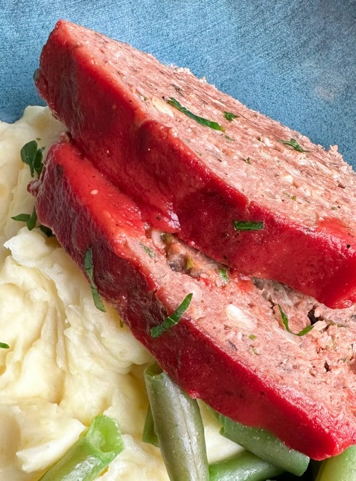 Picture of 2 slices of keto meatloaf with sugar-free glaze