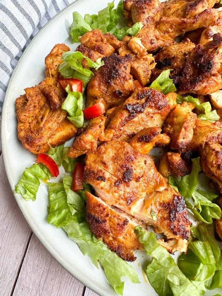Picture of a plate of keto chicken shawarma with salad