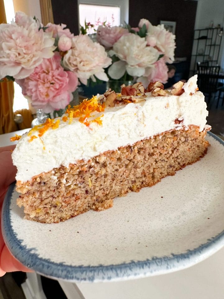 Picture of a slice of keto carrot cake with cream cheese icing