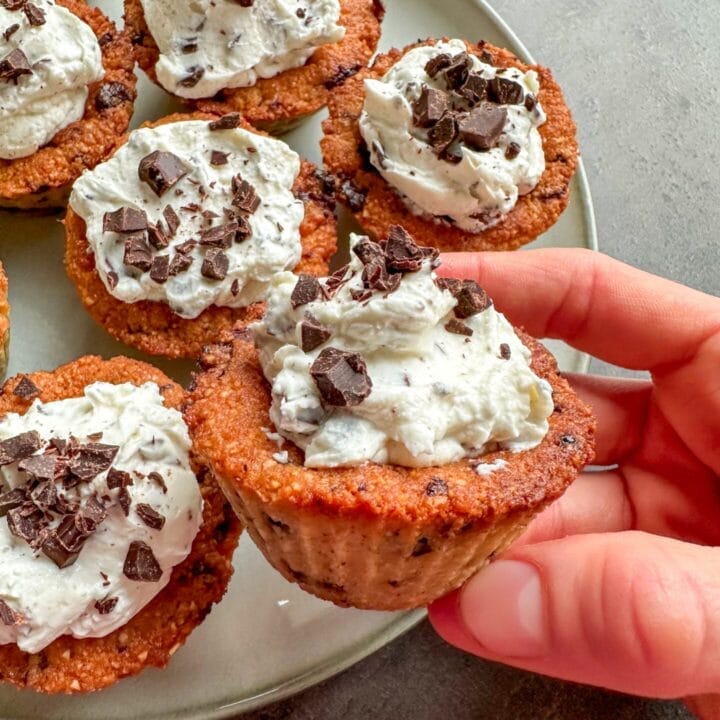 Picture of a plate with keto cannoli chocolate chip cookie cups.